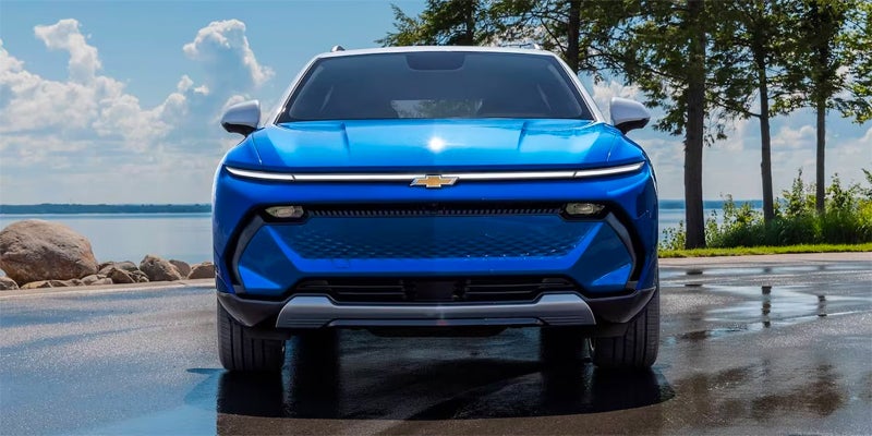 2024 Chevrolet Equinox EV parked beside the sea