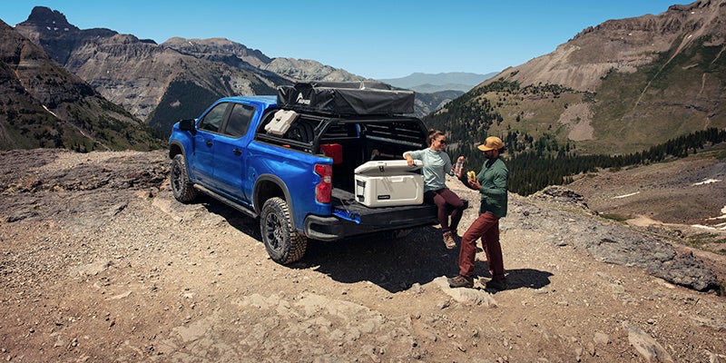 Chevrolet Silverado 1500 parked in front of hills, ready for off-road driving