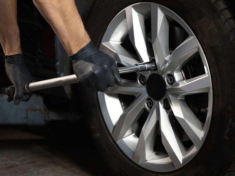 i.g. Burton Chevrolet of Berlin in Berlin MD technician adjusting wheel