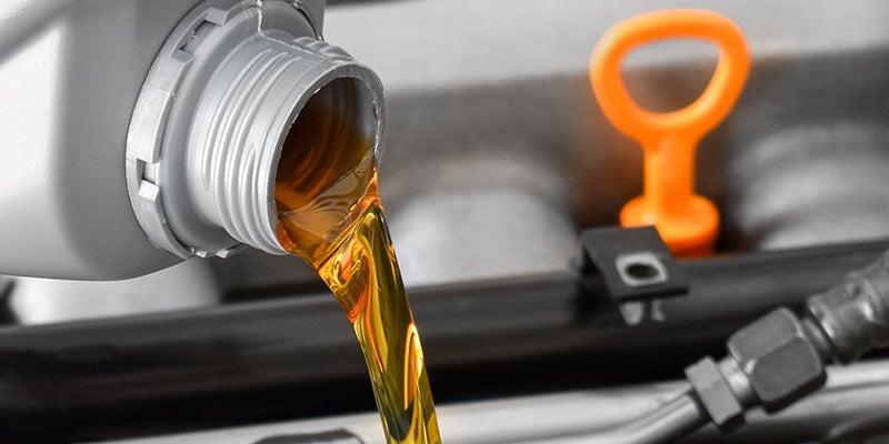 i.g. Burton Chevrolet of Berlin in Berlin MD close up of oil pouring into an engine