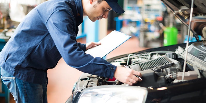 i.g. Burton Chevrolet of Berlin in Berlin MD service technician working on car