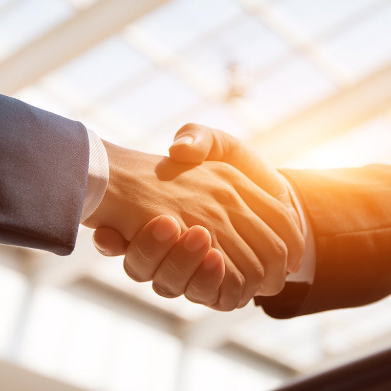 i.g. Burton Chevrolet of Berlin in Berlin MD sales rep shaking hands with customer
