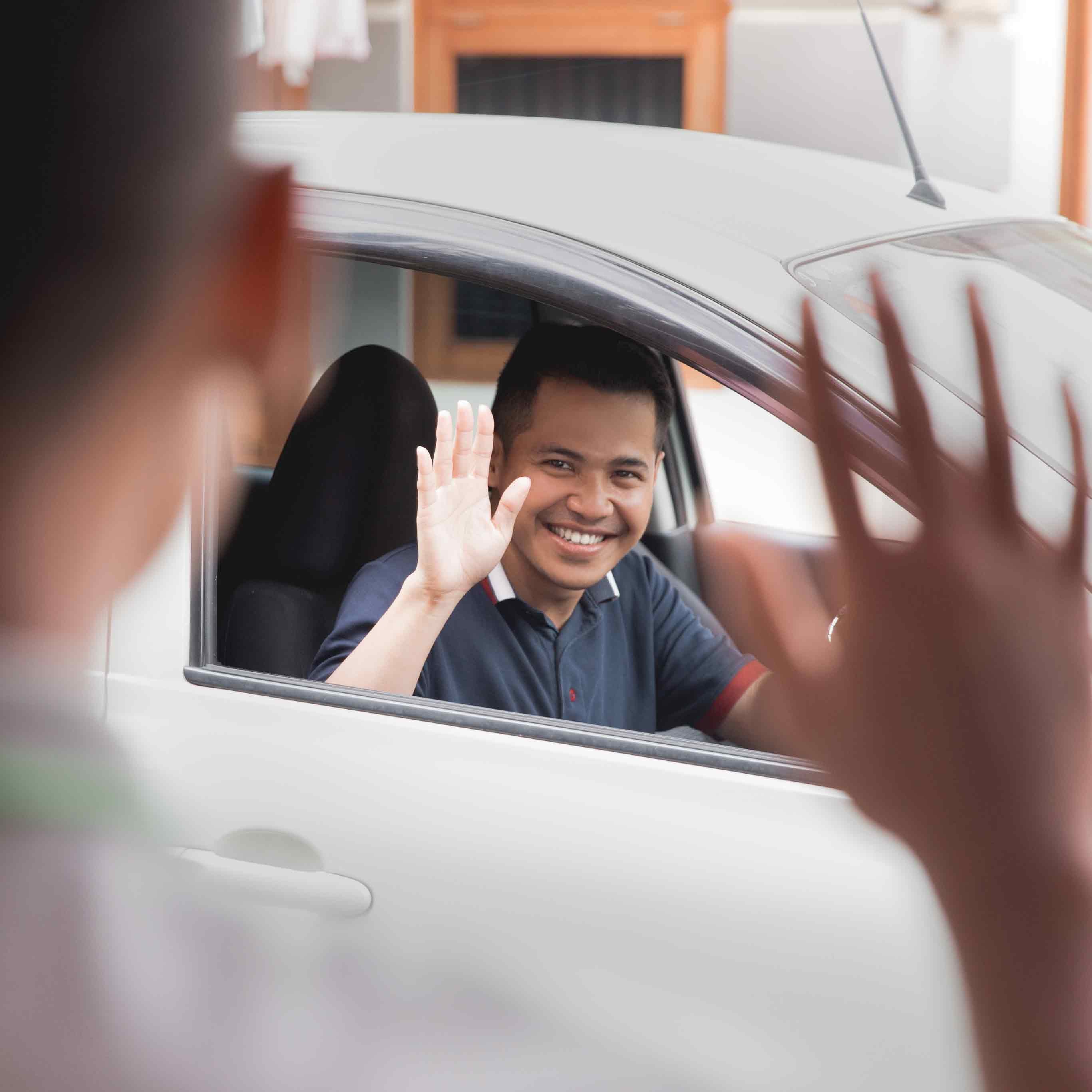 i.g. Burton Chevrolet of Berlin in Berlin MD sales rep waving at customer